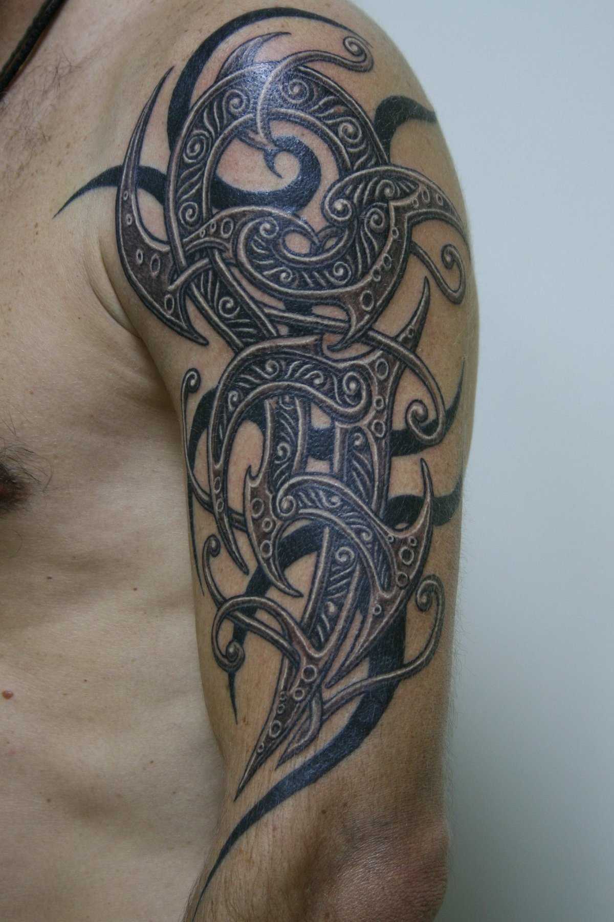 Татуировки на руке для мужчин в виде кельтских узоров: 42 фото